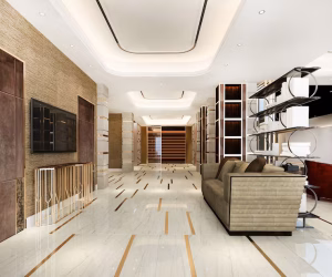 Luxurious and modern interior, possibly a lobby or high-end lounge, featuring white marble flooring with striking gold inlay strips, textured beige walls with dark paneling and a wall-mounted TV, a contemporary beige sofa, and illuminated shelving units.